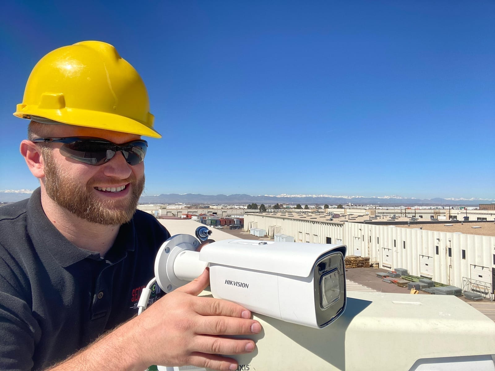 Technician installing a commercial security camera
