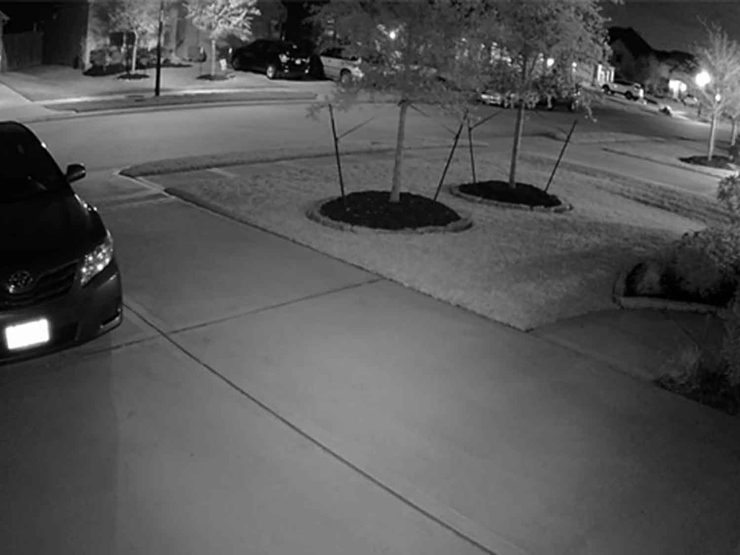 Night vision security camera on a residential street