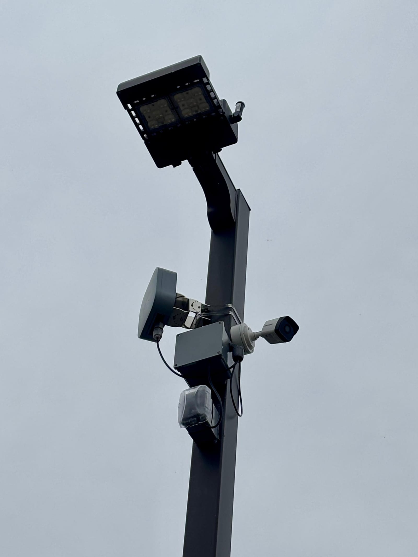 Security camera and LED floodlight mounted on a pole